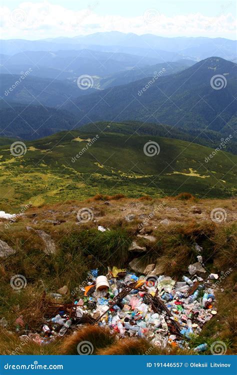 Garbage Dump On A Mountain With A Nature Reserve In The Background Of A