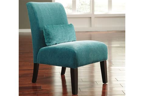 Shown here in natural linen, this comfy tailored armchair is available in a wide range of upholstery options. Annora Teal Accent Chair by Ashley at Gardner-White