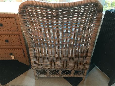 White upholstered seats are included, but cushions are not. Woven Wicker Armchair