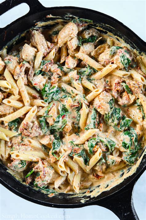 Creamy Tuscan Chicken Pasta in a cast iron skillet. in ...