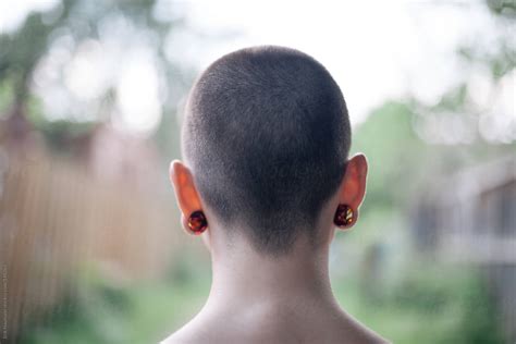 Girl With Shaved Head By Erik Naumann