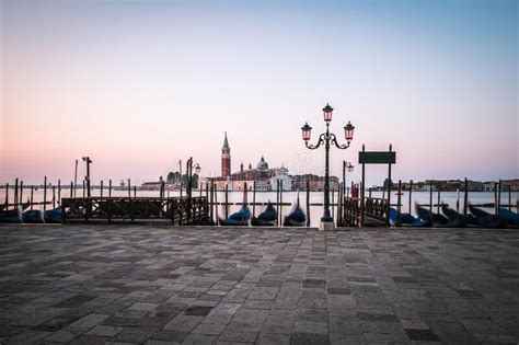 Gondolas With Church Of San Giorgio Maggiore In Venice Italy On The
