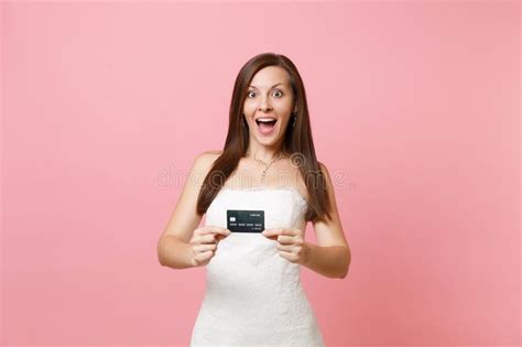 Monroe avenue and 21749 w. Portrait Of Excited Bride Woman In White Wedding Dress Showing Credit Card On Camera On Pink ...
