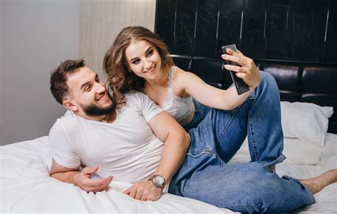 Premium Photo Man And Woman Lying In Bed Together
