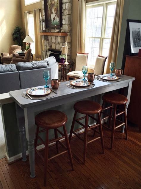 The lamp cords run behind the console table, using command strip hooks so you don't see them, and plug into the wall. FOR SALE: Serving Bar table available for $600 through Etsy. Made with love in Philadelphia! # ...