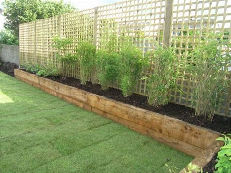 Raised beds provide some degree of pest and animal control. Simple Beds Design Raised Garden Beds Against Fence Modern ...