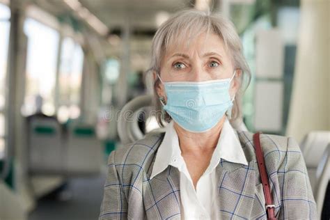 portrait of senior woman in face mask sitting in tram stock image image of elderly epidemic