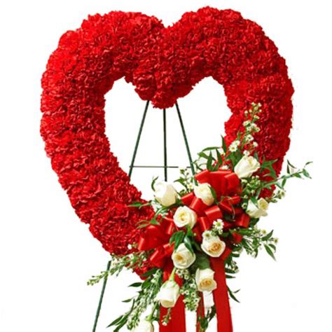 Flowers provide a fitting way to send your condolences following the sad news of a passing. Red Glory Sympathy Wreath | Funeral flower arrangements ...