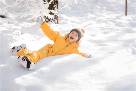 Preschool Boy In Winter Having Fun In The Snow Stock Photo Image Of