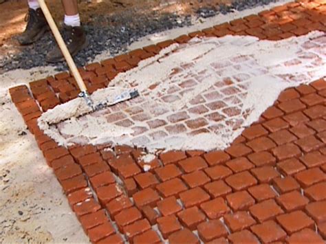 Before you grout your bricks, you want to seal the bricks because p they will absorb water from your grout. How to Install a Cobblestone Patio | how-tos | DIY