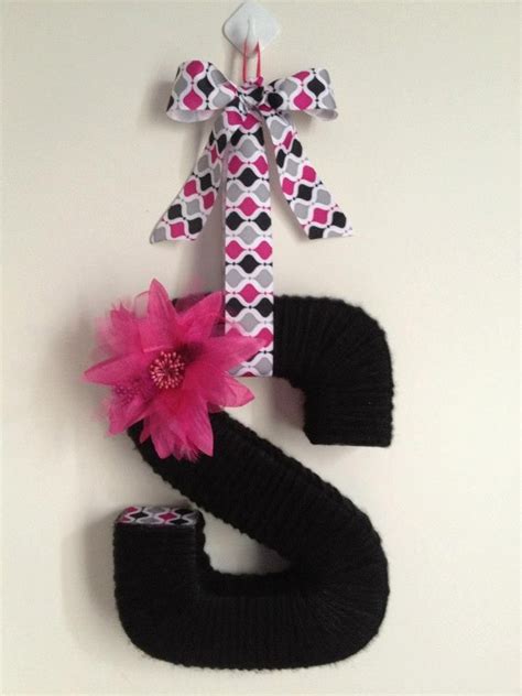 Yarn Wrapped Letter Decorated With Coordinating Ribbon And Flowers