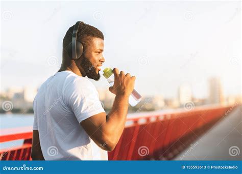 Young Black Man Drinking Water On The Bridge Stock Image Image Of