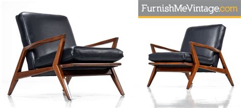 Shop with afterpay on eligible items. Pair of black leather mid century modern arm chairs