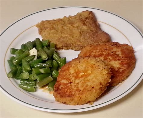 Heat oven to 350 degrees. Pan fried cube steak, leftover mashed potato and cheddar pancakes, and steamed green beans and ...