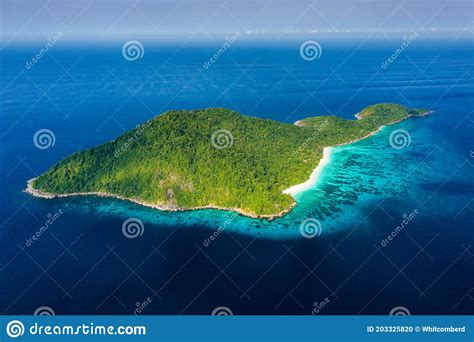 Aerial View Of A Deserted Beach On A Rugged Tropical Island Surrounded