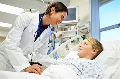 Boy Talking To Female Doctor In Emergency Room Stock Photo Image Of