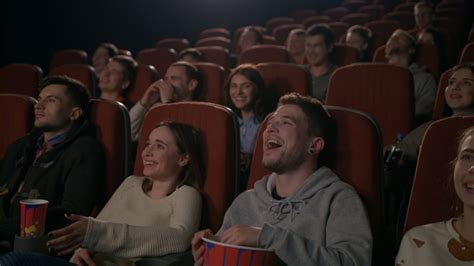 Young People Laugh At Comedy Movie In Cinema Theatre People Laughing