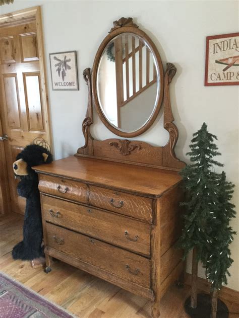 I Have A Antique Oak Dresser With A Oval Tilt Mirror And Wooden Wheels