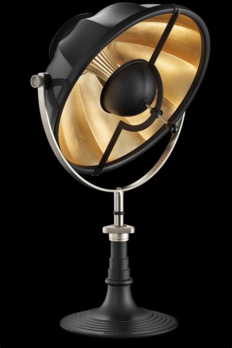 Make of iron and finished in brass this is a true statement piece. Armilla Black & Gold leaf table lamp - Fortuny