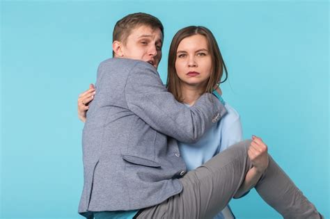Premium Photo Woman Carrying Man In Her Arms