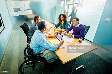 Business People Using Digital Tablets In Office Meeting High Res Stock