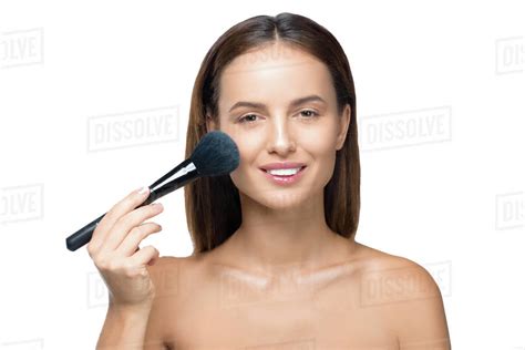 Beautiful Naked Girl Applying Makeup With Brush And Smiling At Camera
