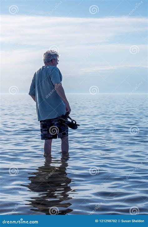 Senior Male Walking In The Waves Stock Photo Image Of Beauty