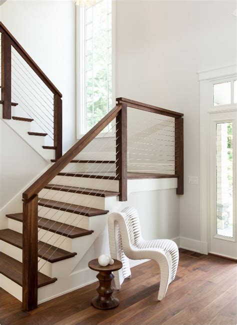 This streamlined railing design was constructed of inexpensive lumber stained dark gray. Stunning Stair Railings | Centsational Style