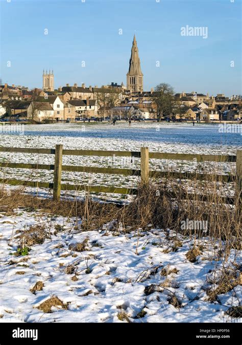 Lincolnshire Town Of Stamford Seen Across Water Meadows In Winter Snow