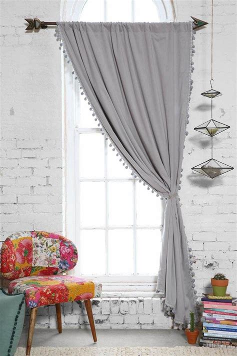Featuring luxurious red and grey textured geometric patterning, this pair of lined curtains are fabricated from a durable polycotton blend, complete with an eyelet header. Pompons en laine pour décorer les rideaux et les coussins | Déco salon, Rideaux et Idee rideaux