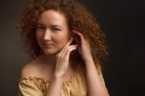 Studio Portrait Of A Woman With Brown Curly Hair Stock Image Image Of