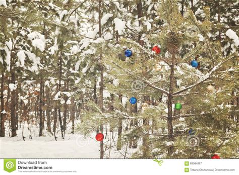 Decorated Christmas Tree In A Snowy Pine Forest With Retro Effect Stock