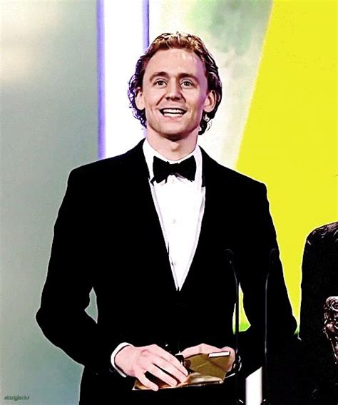 2.tom hiddleston tom huddleston wears a suit/tux better than any man in the history of ever and i will die on this hill. Tom Hiddleston, BAFTA *gif*... The dimples are out in full ...