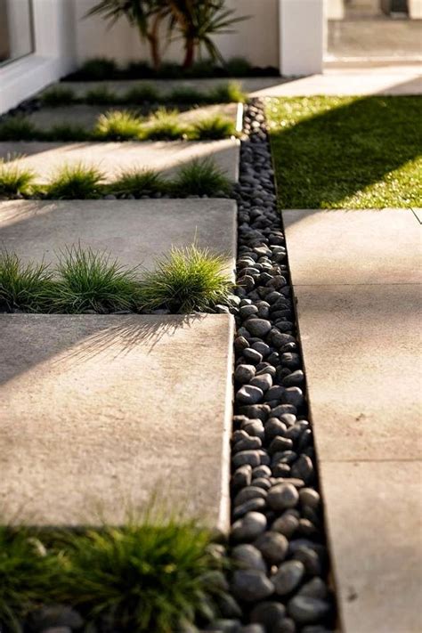 For extra seating, you can construct benches on the side with the same stones of the pergola and surround the pergola with pebbles. concrete pavers black pebbles - Google Search | Backyard ...