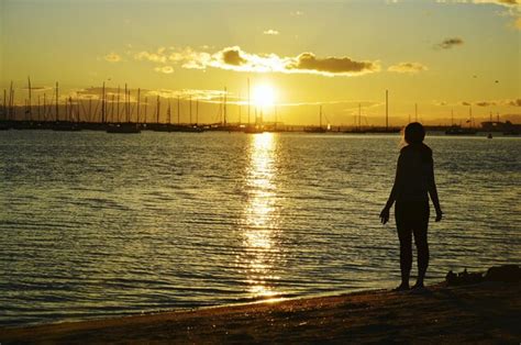 Premium Photo Rear View Of Silhouette Woman Standing At St Kilda