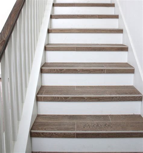 Interior Wood Plank Tile On Staircase With White Painted Railings Ideas