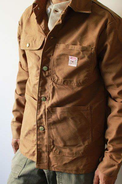 The larger chore coat wing collar has been replaced with a small standing band. Pointer Brand Barn Coat - BARN DECOR