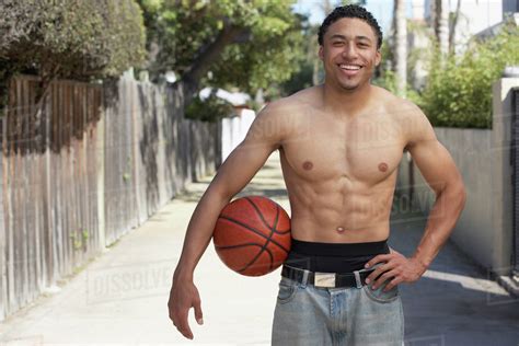 Babe Mixed Race Man With Bare Chest Holding Basketball Stock Photo Dissolve