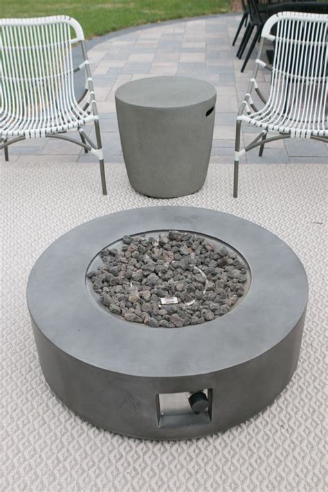 Fire sense columbia 34 round lpg aluminum lpg/ng fire pit table | antique bronze finish | uses 20 pound propane tank | fire bowl lid, vinyl over and clear fire glass included 4.4 out of 5 stars 5 $716.62 $ 716. How To Hide A Propane Tank From Your Patio's Fire Pit ...