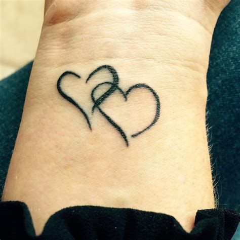 Hand Heart Tattoo Designs