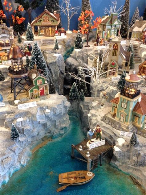 One of my favorite christmas memories as a child was watching and staring at my uncle my village base is made of pressed wood. Galleries | Showcase Displays | Dept 56 ideas | Christmas ...