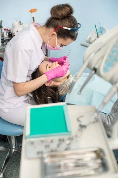 Female Dentist Treating Patient Teeth Stock Image Everypixel