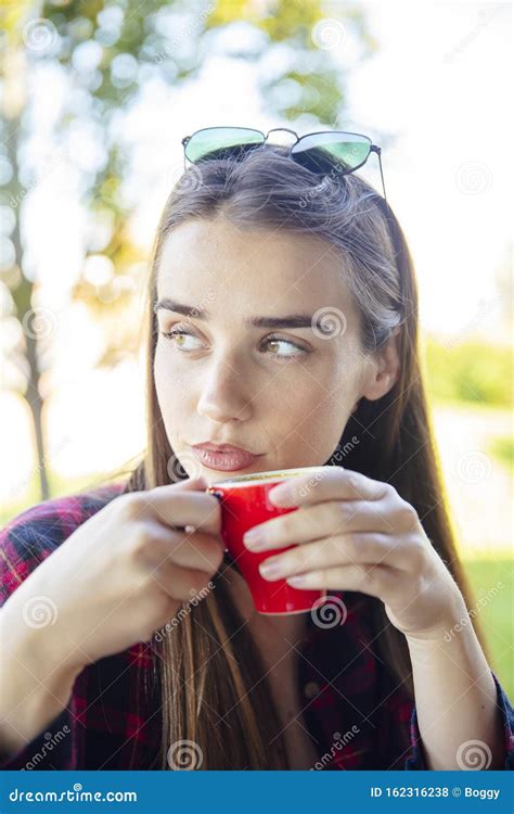 Young Woman Drinking Coffee In The Park Stock Photo Image Of Young