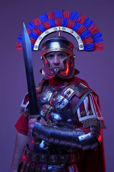 Shot Of Ancient Roman Soldier Posing In Colorful Dark Light Stock Image