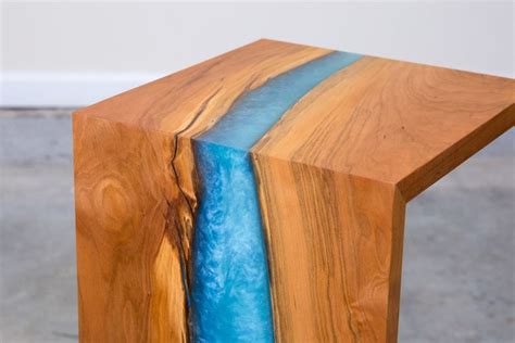End table of thick glass with green tones and chrome accents. You Can Build this Gorgeous DIY Waterfall Table