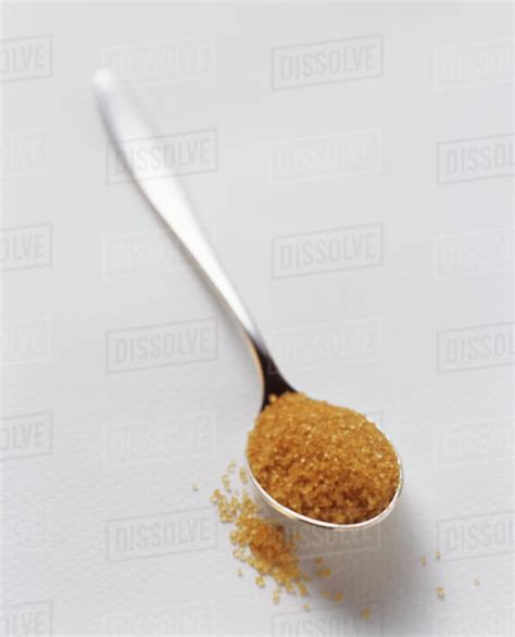 Brown Sugar On A Teaspoon Stock Photo Dissolve