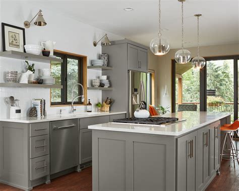 A sure bet is benjamin moore downpour blue on the lower cabinetry paired with benjamin moore co 17 white dove on the upper cabinets. 12 Beautiful Gray Kitchen Cabinets - Interiors By Color