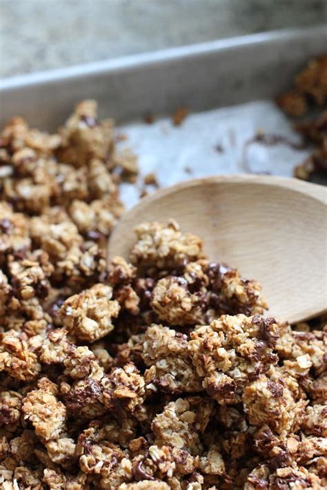 In a medium glass bowl combine granola, honey, and peanut butter with a wooden spoon until well combined. Peanut Butter & Dark Chocolate Granola | RecipeLion.com