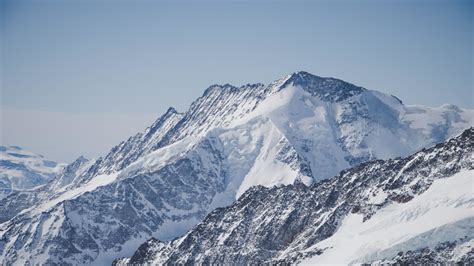 Download 1366x768 Wallpaper White Glacier Mountains Summit Tablet