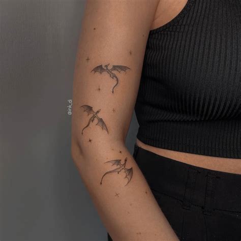 Small Dragons Tattooed On The Arm